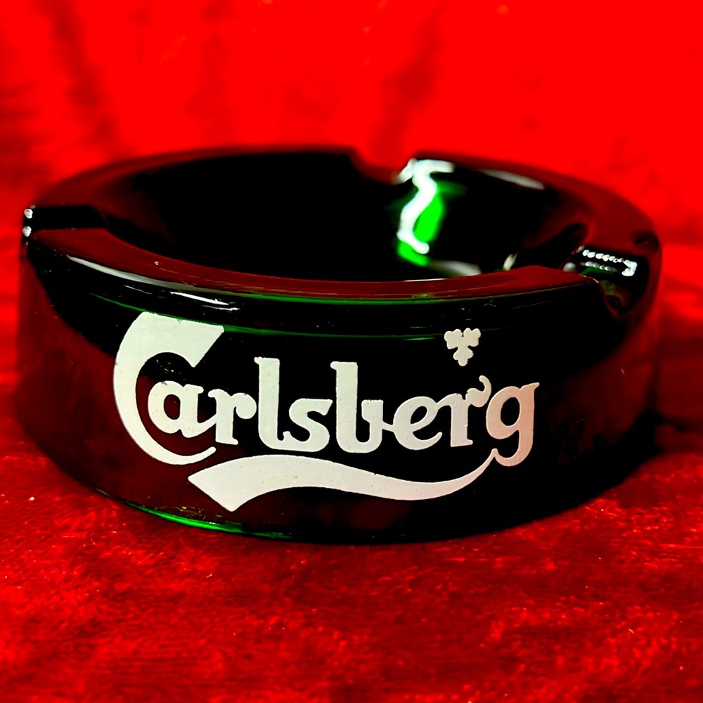 Green glass Carlsberg collectible ashtray.